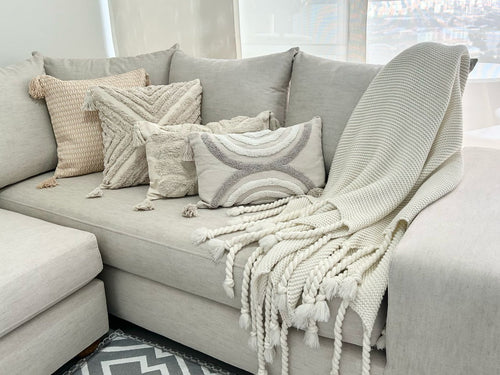 Manta fraza tejida beige  lazos 127x152 cm