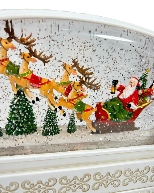 Burbuja musical de trineo y santa 24x15cm