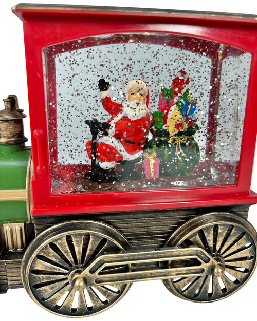 tren santa en pasta funciona  con luz musical y tambien con  3 pilas aa mide 28 cm de largo x 17 cm de ancho