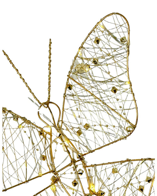 mariposa metalica hilos dorados con pila AA mide 40 cm de alto x30 cm de ancho