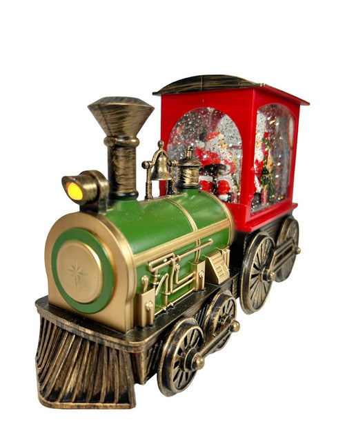 tren santa en pasta funciona  con luz musical y tambien con  3 pilas aa mide 28 cm de largo x 17 cm de ancho